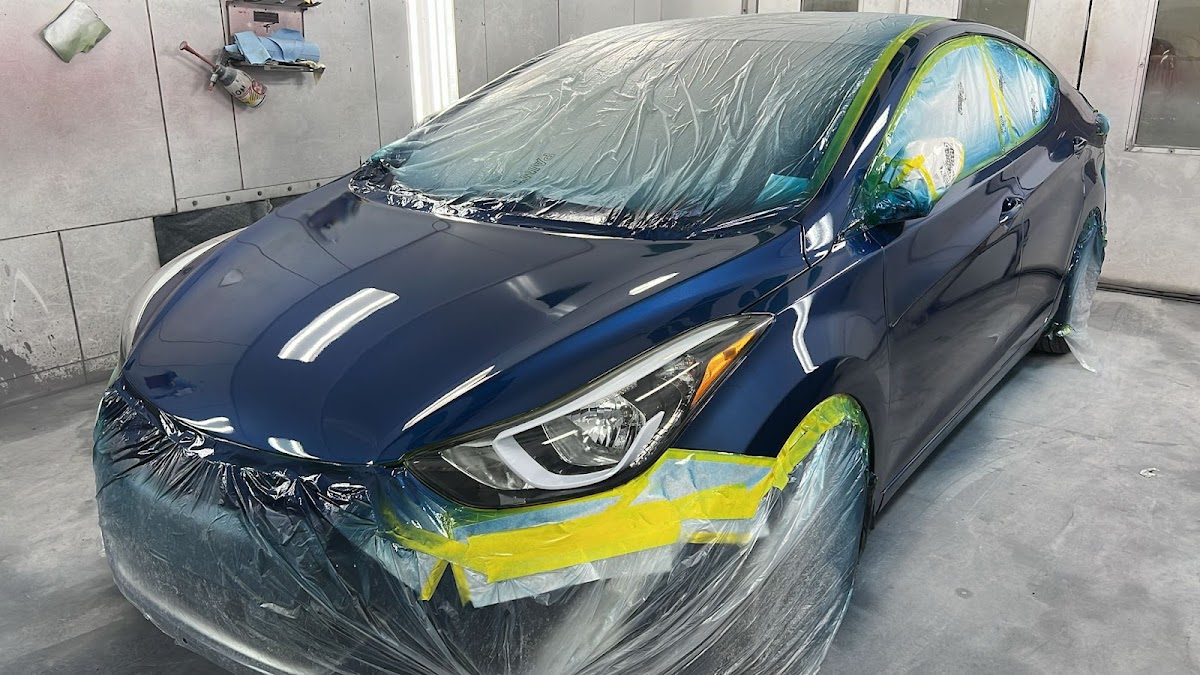 Hyundai sedan masked for paint at Zuniga Auto Body